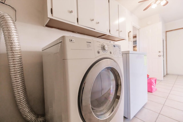 clothes washing area featuring ceiling fan, cabinets, light tile patterned floors, and washer / clothes dryer