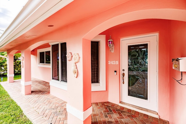 property entrance featuring a porch