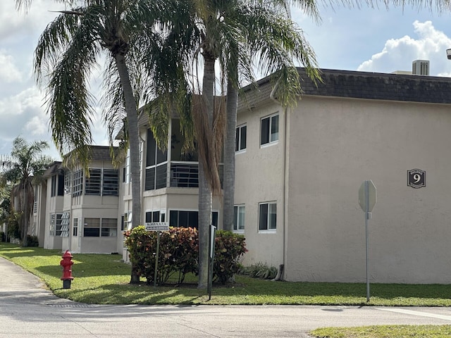 view of building exterior with cooling unit