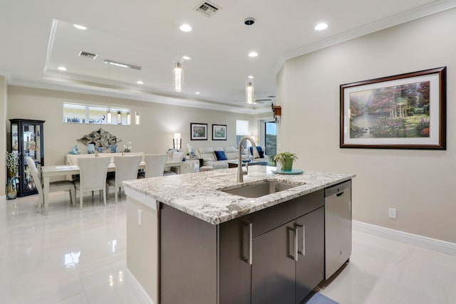 kitchen with stainless steel dishwasher, a healthy amount of sunlight, sink, and an island with sink