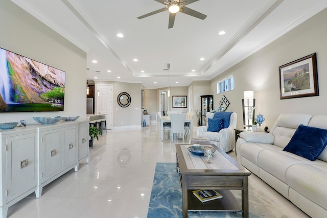 living room featuring ornamental molding and ceiling fan