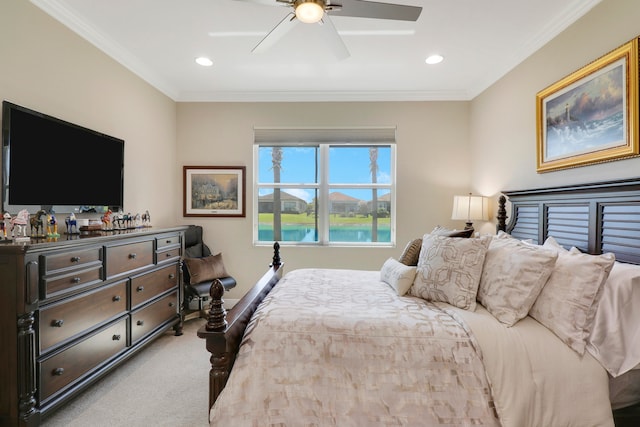 carpeted bedroom featuring crown molding, a water view, and ceiling fan