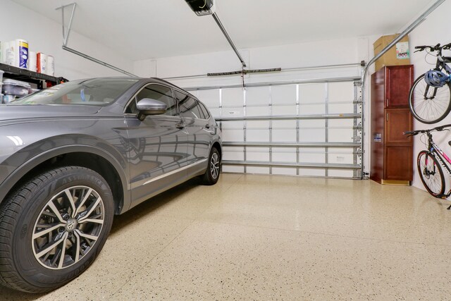 garage featuring a garage door opener