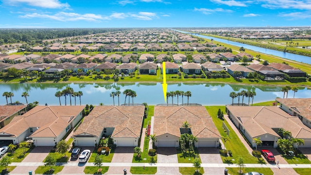 birds eye view of property with a water view