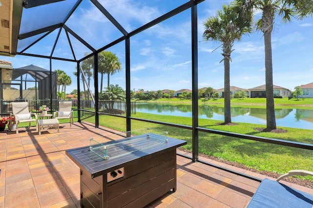 sunroom / solarium with a water view