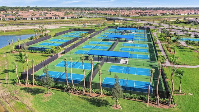 birds eye view of property with a water view