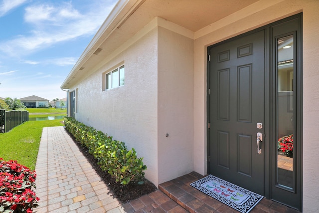 entrance to property featuring a water view