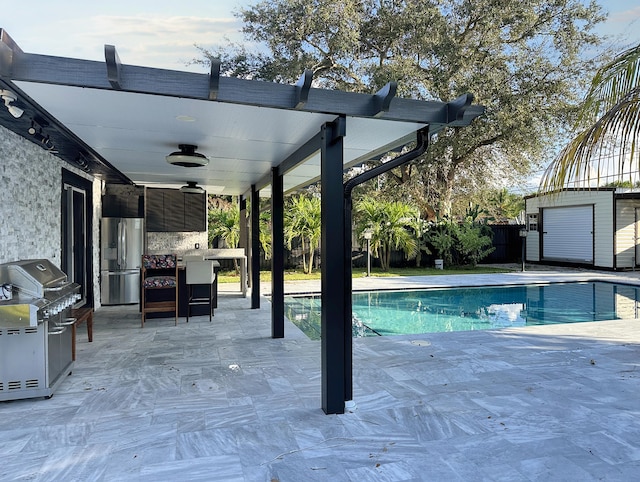 view of swimming pool featuring a patio, ceiling fan, and a grill