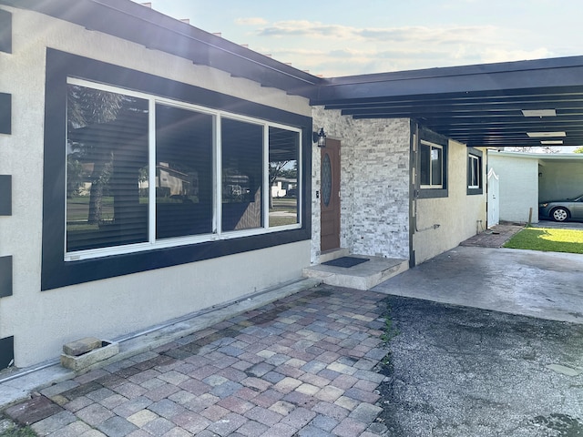 view of side of property with a carport