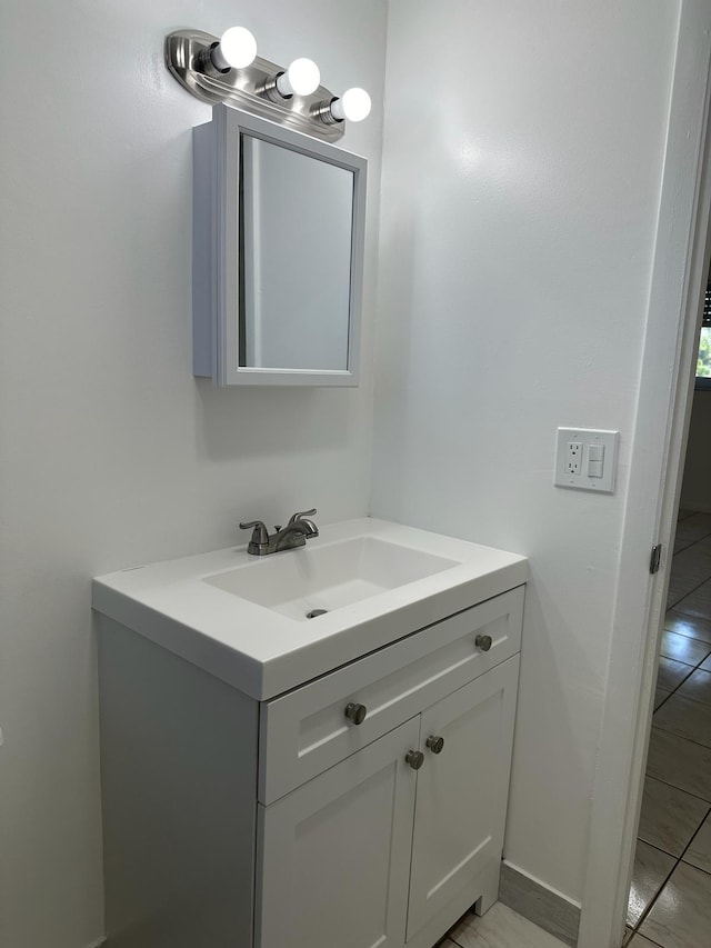 bathroom featuring vanity and tile patterned flooring