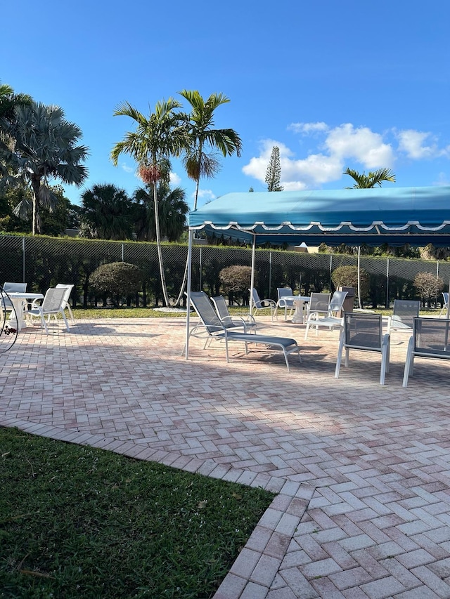 view of jungle gym featuring a patio