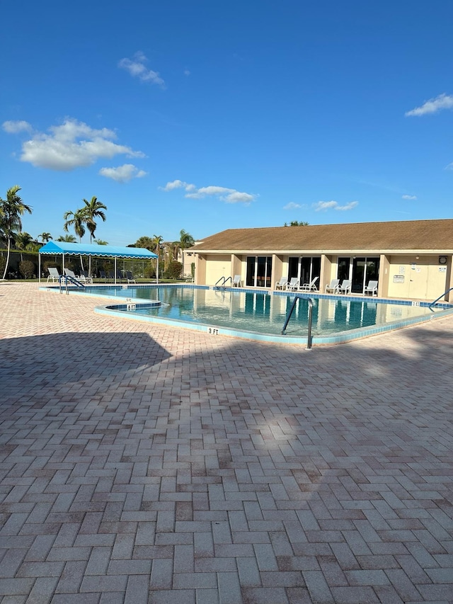 view of swimming pool with a patio area