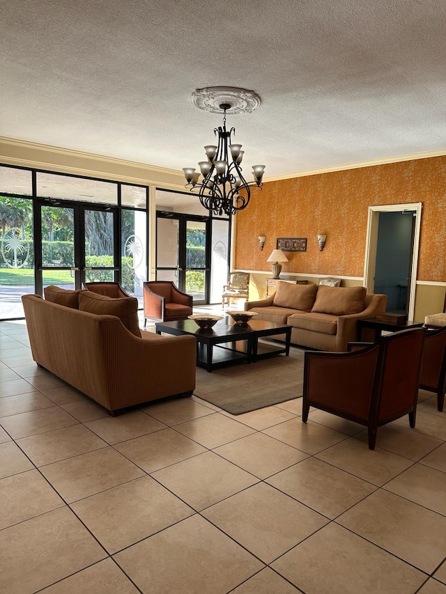 living room featuring ornamental molding, french doors, and a textured ceiling