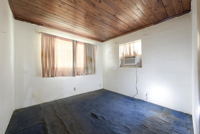 empty room featuring cooling unit, wood ceiling, and crown molding