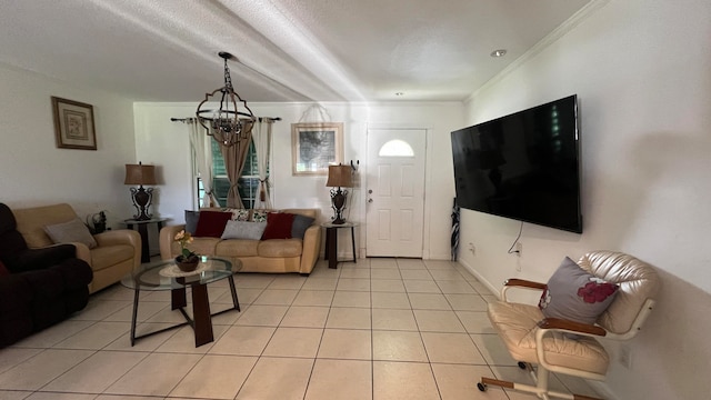 living room featuring a chandelier, light tile patterned floors, and ornamental molding