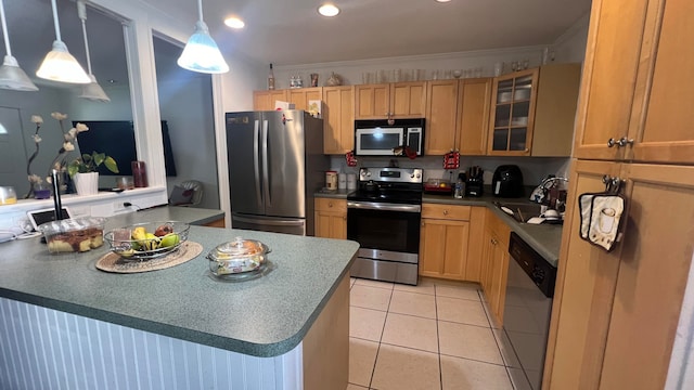 kitchen with ornamental molding, stainless steel appliances, light tile patterned floors, pendant lighting, and sink