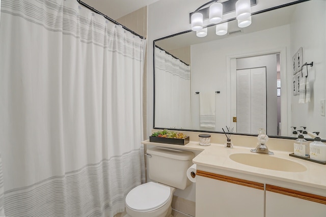 bathroom featuring vanity, a shower with curtain, and toilet