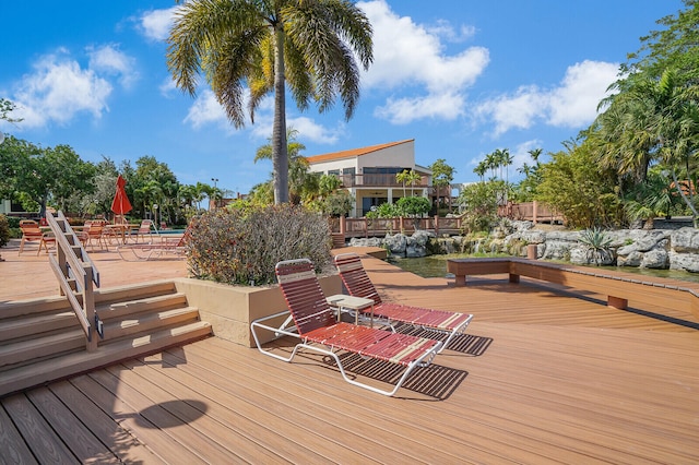 wooden terrace featuring a patio area