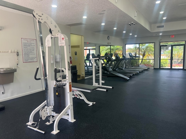 exercise room featuring a textured ceiling