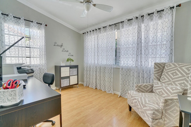 office space featuring ceiling fan, wood-type flooring, and ornamental molding