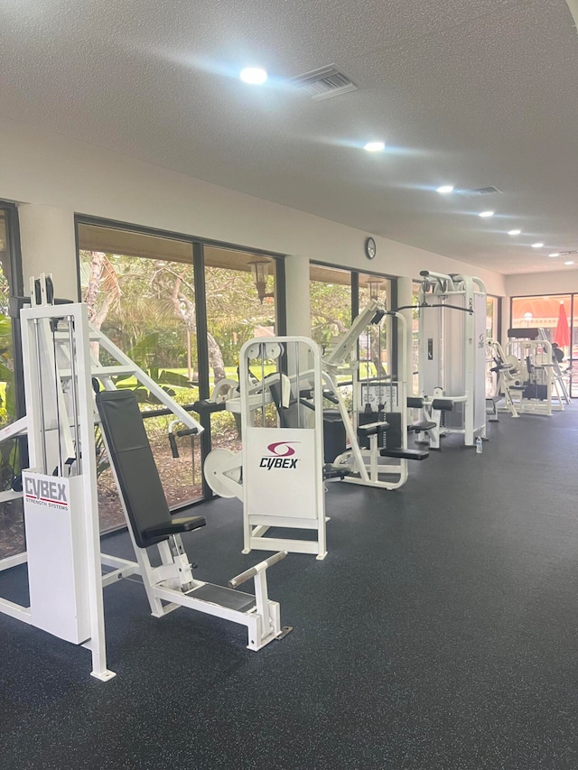 gym with a textured ceiling