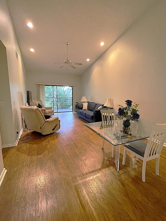 living room featuring hardwood / wood-style flooring and ceiling fan