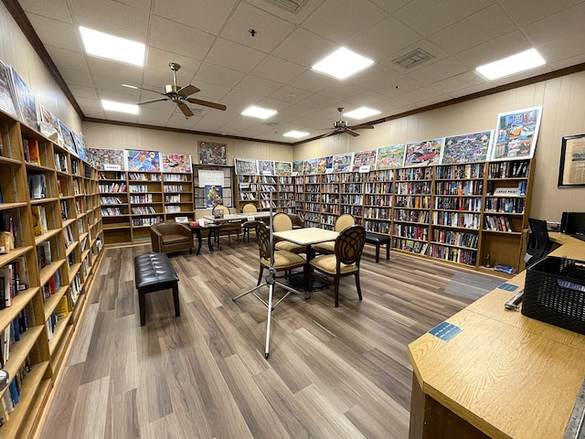 home office featuring wood-type flooring and a drop ceiling