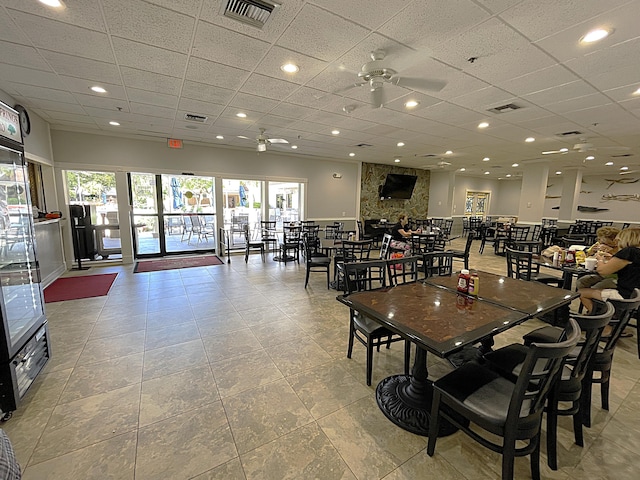 dining room with light tile patterned floors and ceiling fan