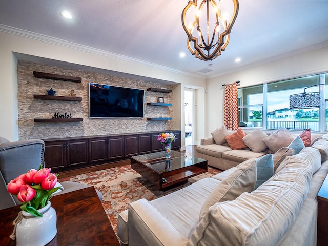 living room featuring light hardwood / wood-style floors, a notable chandelier, and ornamental molding