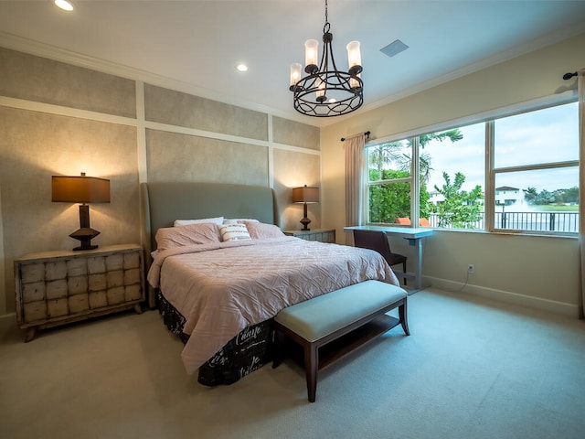 bedroom featuring a notable chandelier, ornamental molding, and carpet flooring