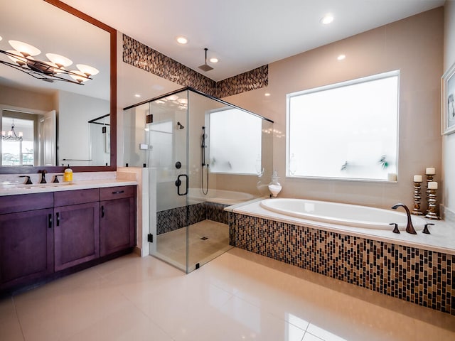 bathroom with vanity, an inviting chandelier, separate shower and tub, and tile patterned flooring