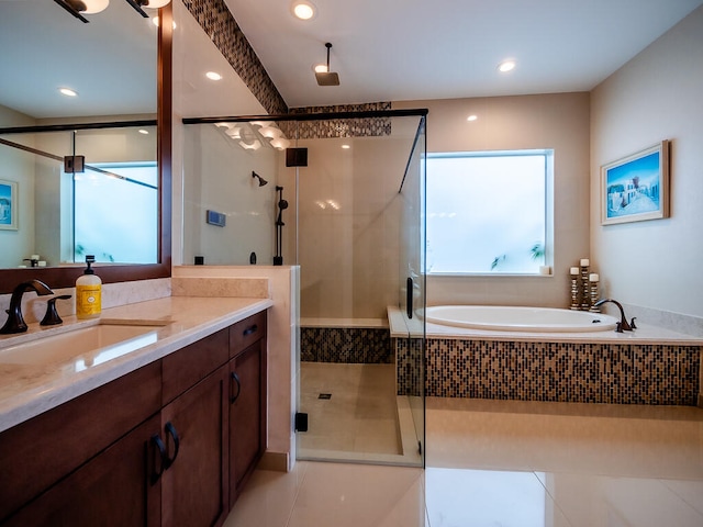 bathroom with vanity, shower with separate bathtub, and tile patterned flooring