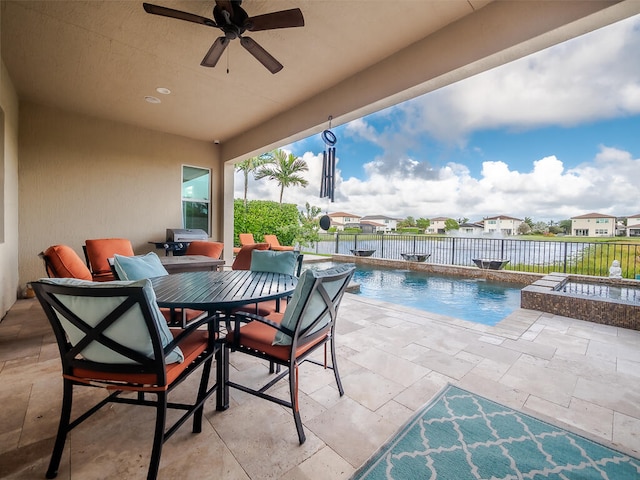 view of pool featuring a patio area, pool water feature, and ceiling fan