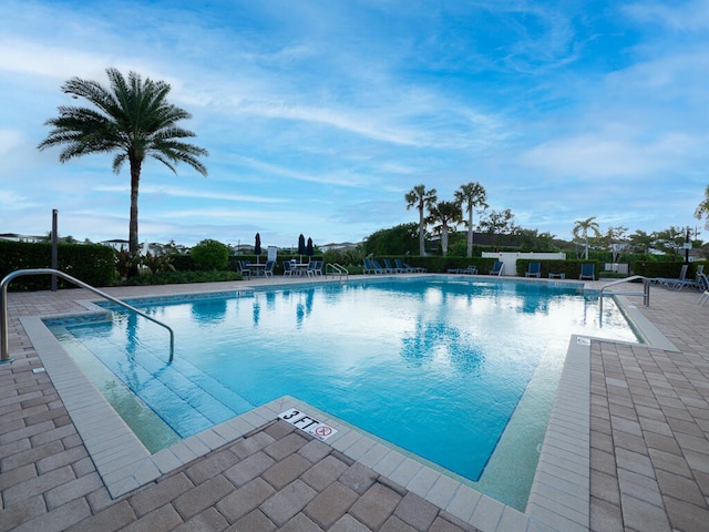 view of swimming pool featuring a patio area