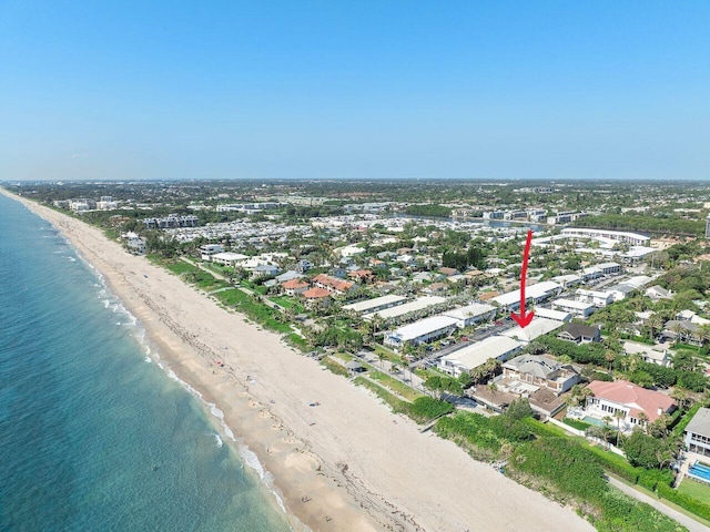 bird's eye view with a water view and a view of the beach