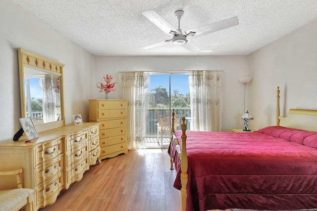 bedroom with light hardwood / wood-style flooring, access to outside, a textured ceiling, and ceiling fan