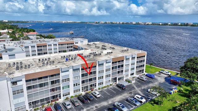 birds eye view of property featuring a water view