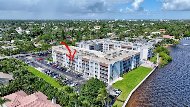 birds eye view of property with a water view