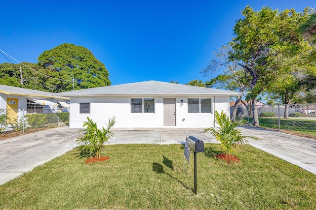 single story home featuring a front yard