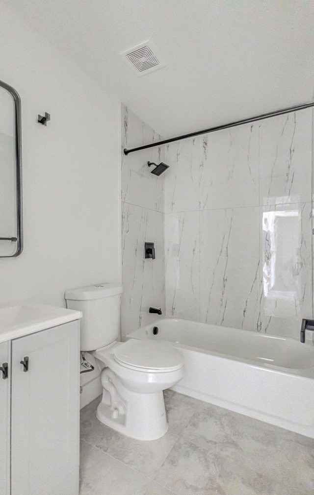 full bathroom featuring vanity, toilet, and tiled shower / bath