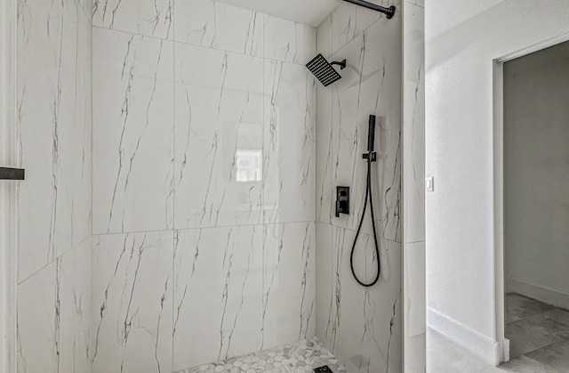 bathroom with a tile shower