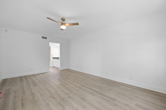 unfurnished room with light hardwood / wood-style flooring and ceiling fan