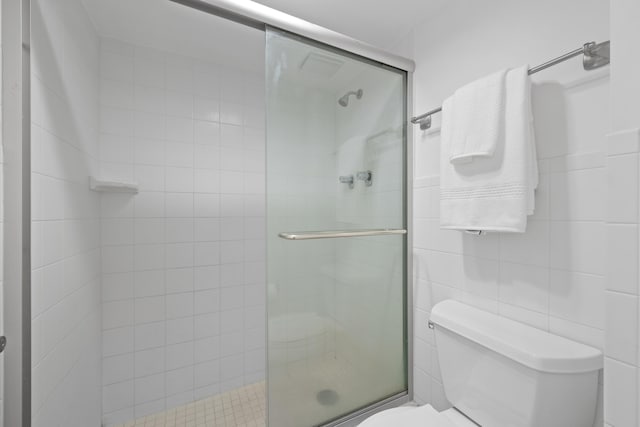 bathroom with toilet and walk in shower