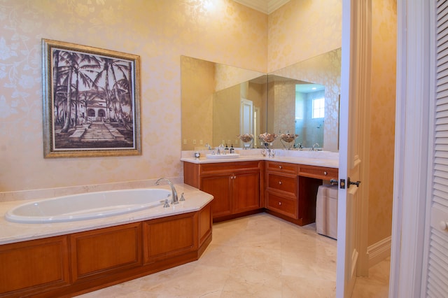 bathroom with vanity, crown molding, and a bath