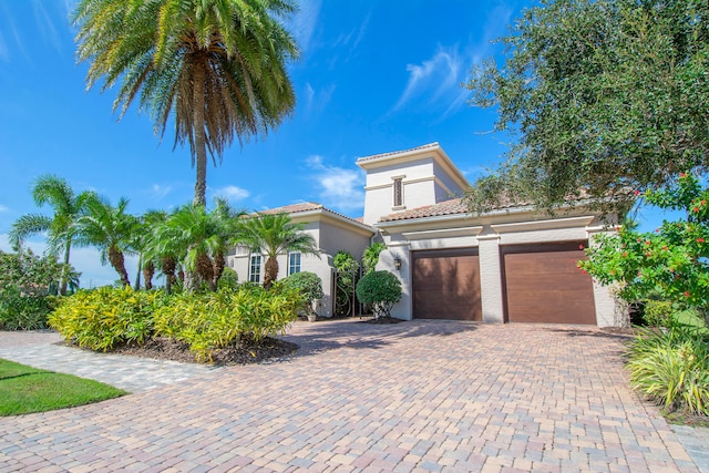 mediterranean / spanish-style house featuring a garage