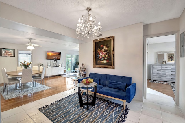 living room featuring hardwood / wood-style floors, a textured ceiling, and a wealth of natural light