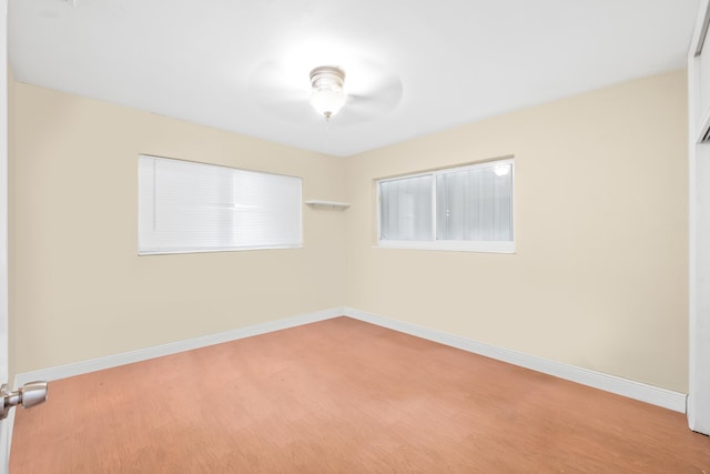 unfurnished room featuring wood-type flooring