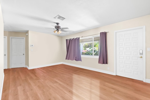 unfurnished room with light hardwood / wood-style flooring and ceiling fan