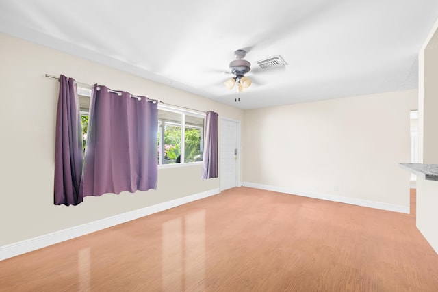 unfurnished room with light hardwood / wood-style flooring and ceiling fan