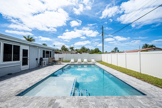 view of swimming pool featuring a patio area